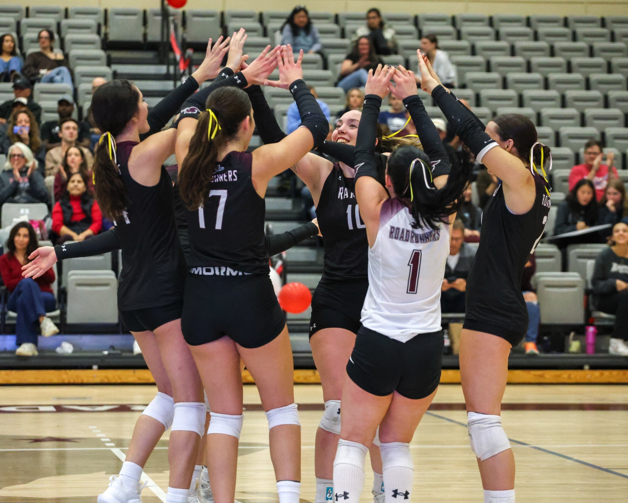 women's volleyball team huddle 2025