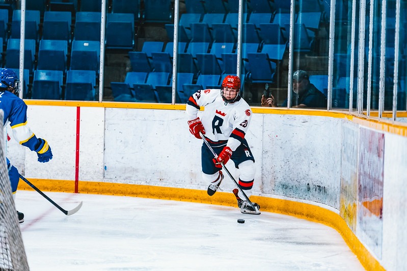 Colton Stanley surveys with the puck