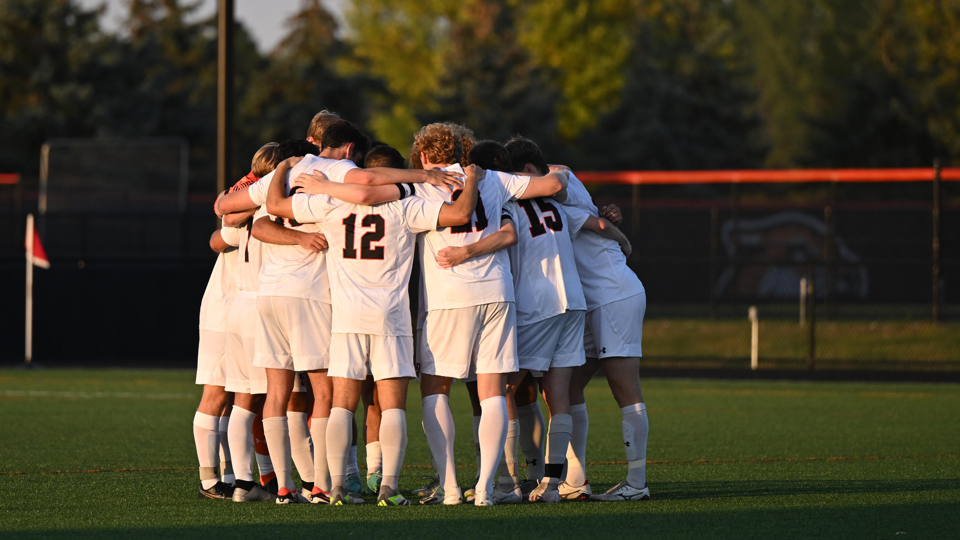 Men's Soccer team huddling