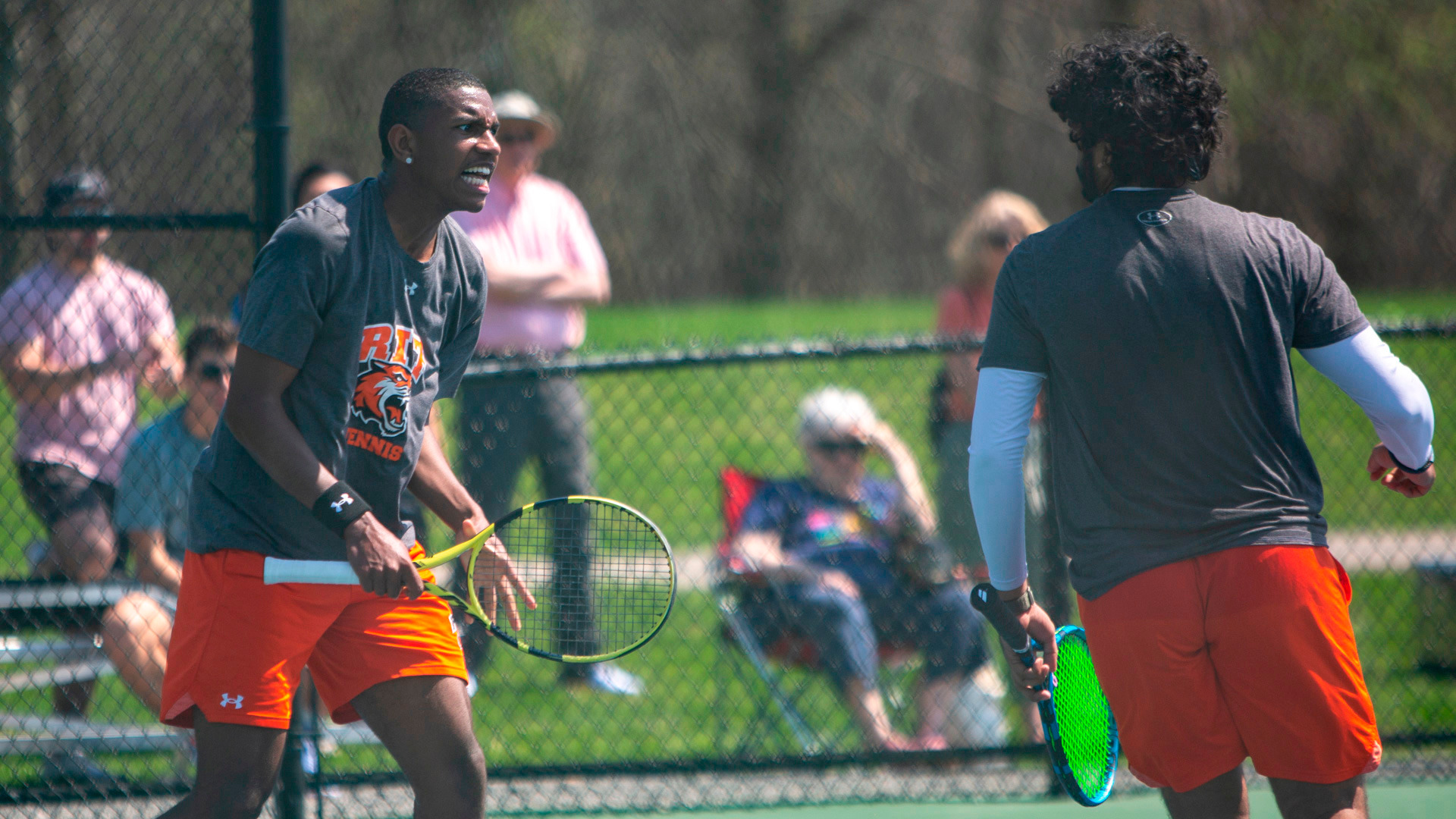 Two tennis players celebrating