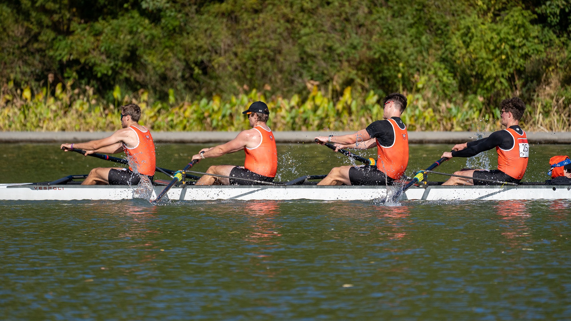 Men's rowing team competing in the Head of the Genesee regatta