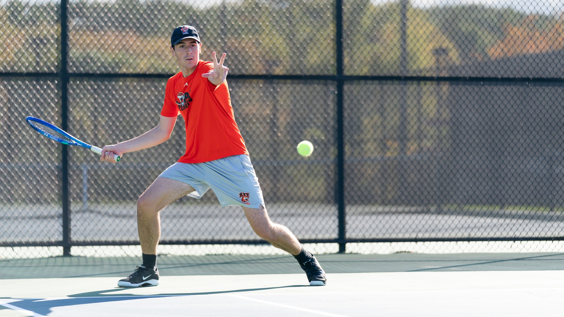 Preparing to hit the ball a Member of the RIT Men’s Tennis team sticks out his hand on October 12th, 2025, at the RIT Tennis Courts in Henrietta, New York. RIT Men’s Tennis match vs St. John Fisher. (Colin Norland/RIT Sports Network).
