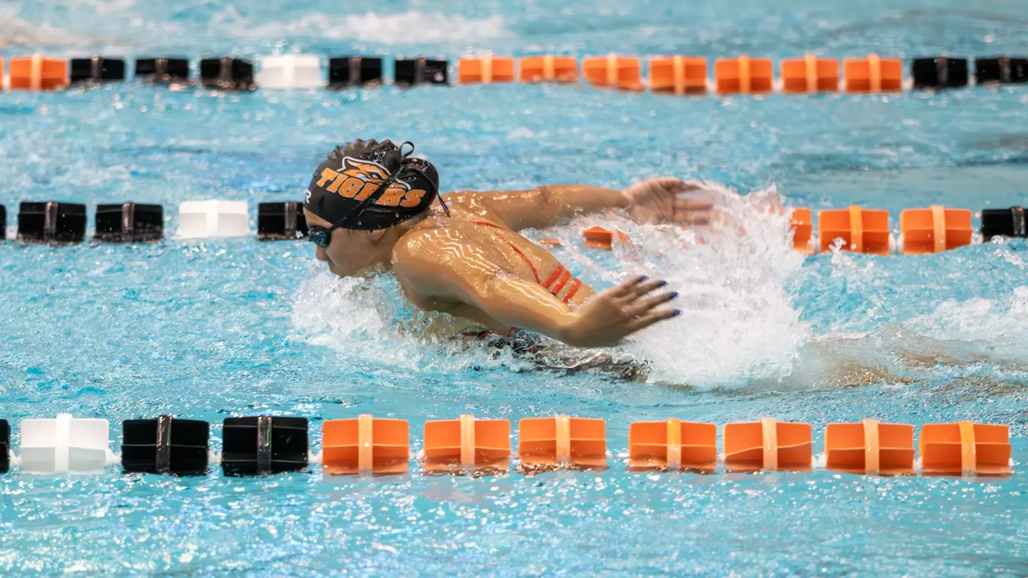a women's swimmer competes in a race for Rochester Institute of Technology against RPI on Saturday, Oct. 11, 2025