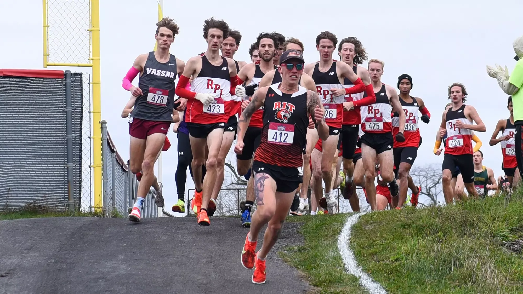 a men's runner leads the pack early on in the 2025 Liberty League Men's Cross Country Championships