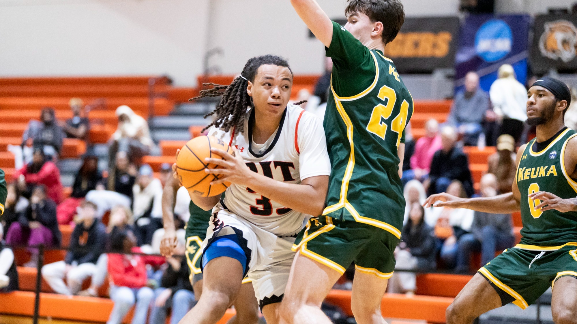 A men's basketball player for Rochester Institute of Technology looks to make a lay up in a game against Keuka on Monday, November 24, 2025