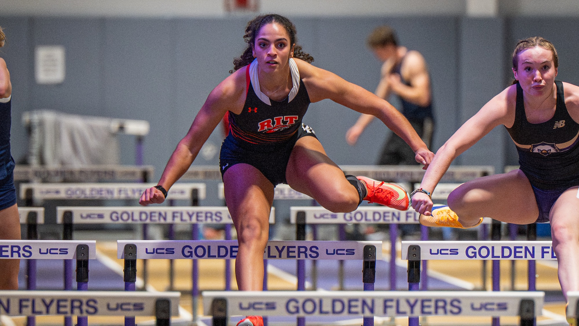 a women's hurdler competes for Rochester Institute of Technology races at the Nazareth Alumni Opener on Friday, December 5, 2025