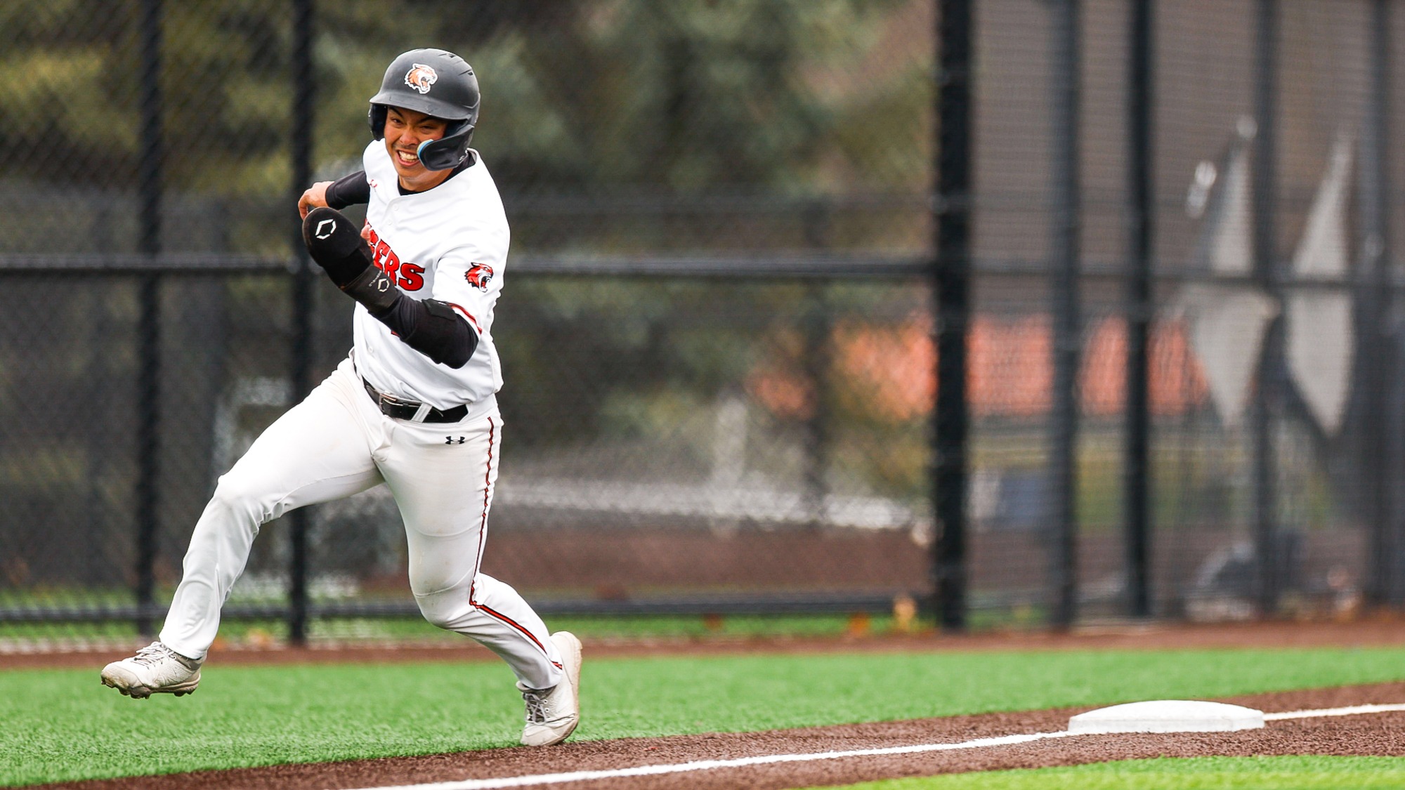A baserunner heads home for Rochester Institute of Technology in a game against Ithacs