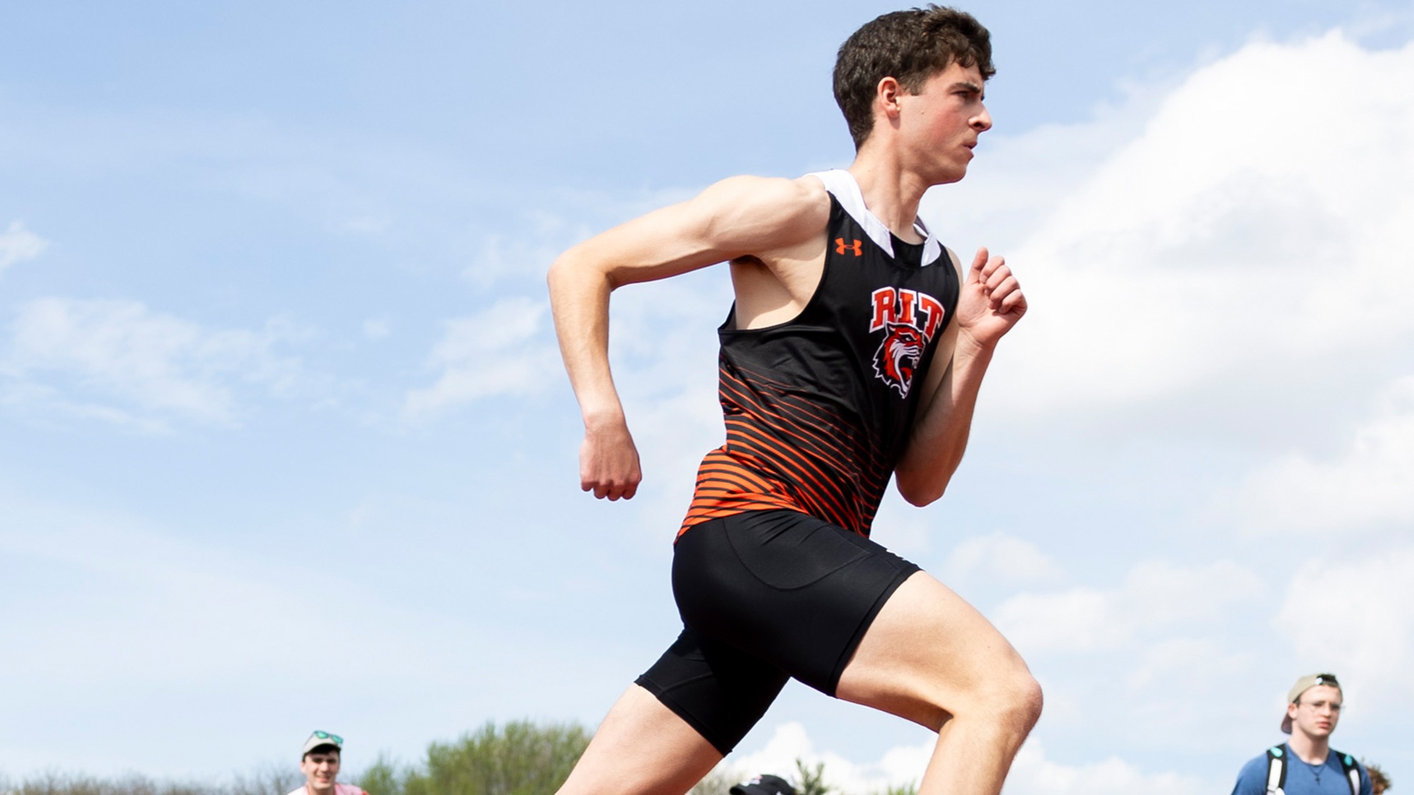 A men's runner starts a races for Rochester Institute of Technology at the 2025 Liberty League Championships