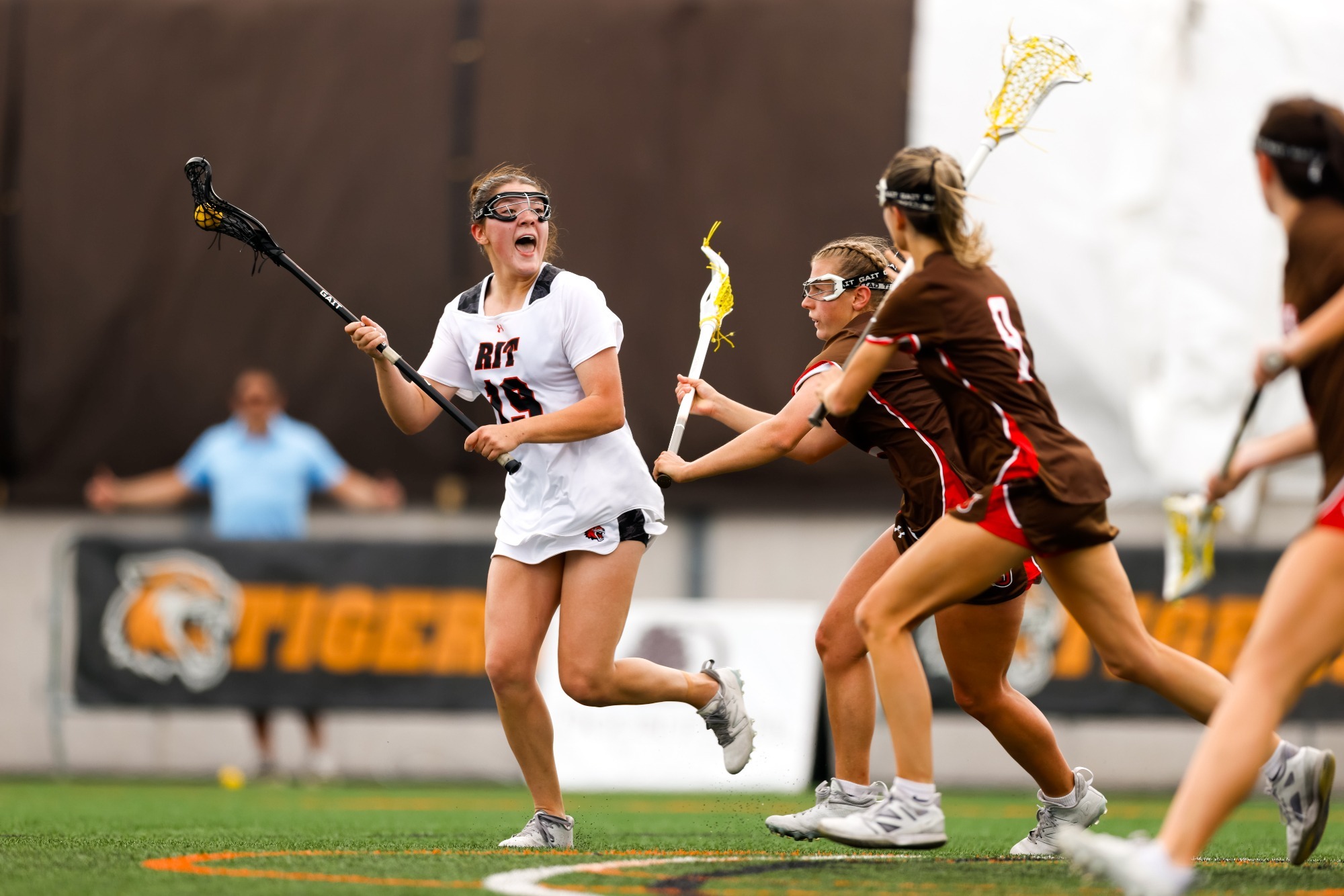 A women's lacrosse player getting ready to make a pass