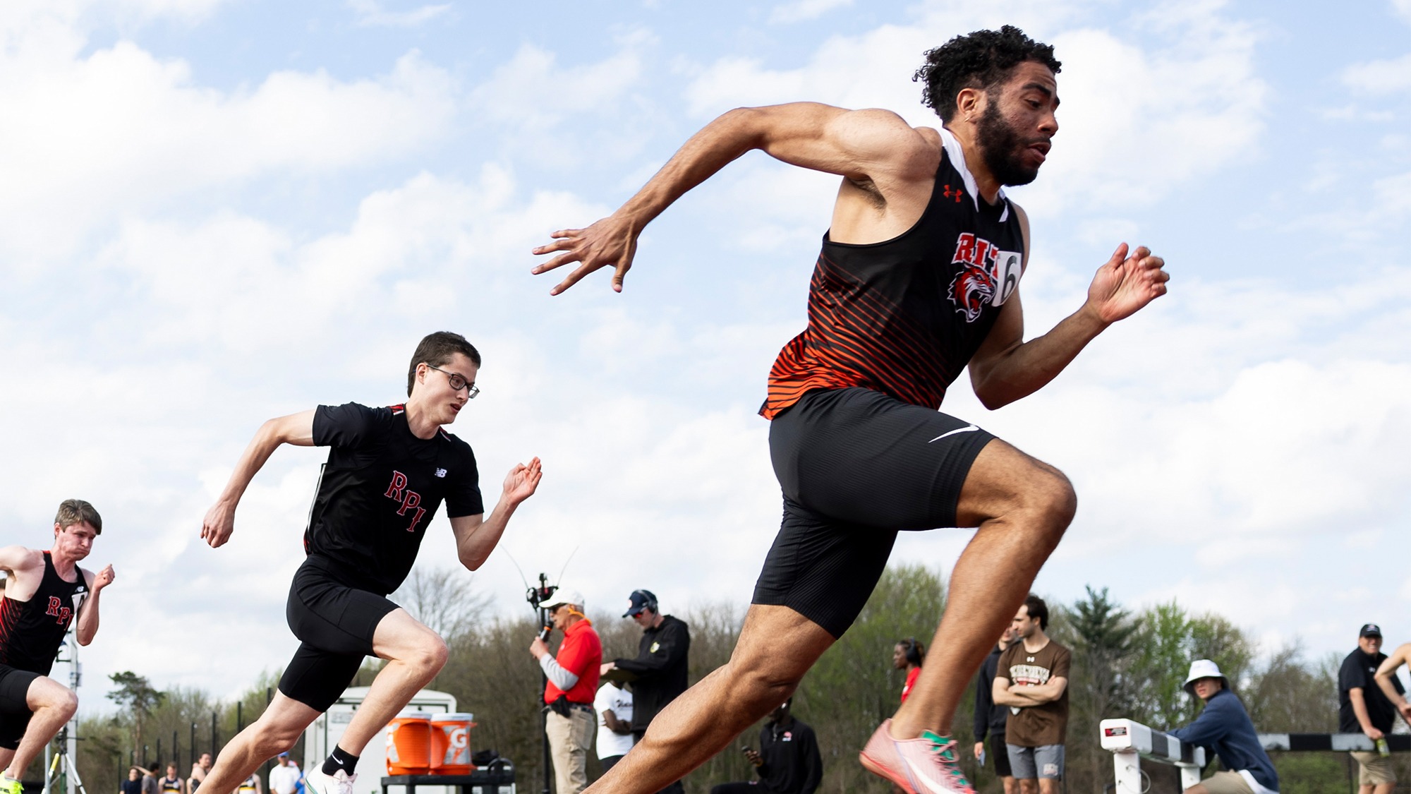 A Rochester Institute of Technology men's sprinter starts a race at the 2025 Liberty League Championships