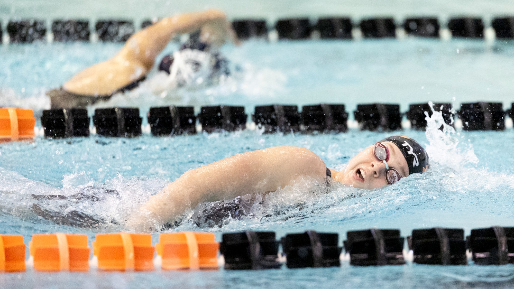 A Rochester Institute of Technology women's swimmer competes in a race against Geneseo on Friday, January 23, 2026