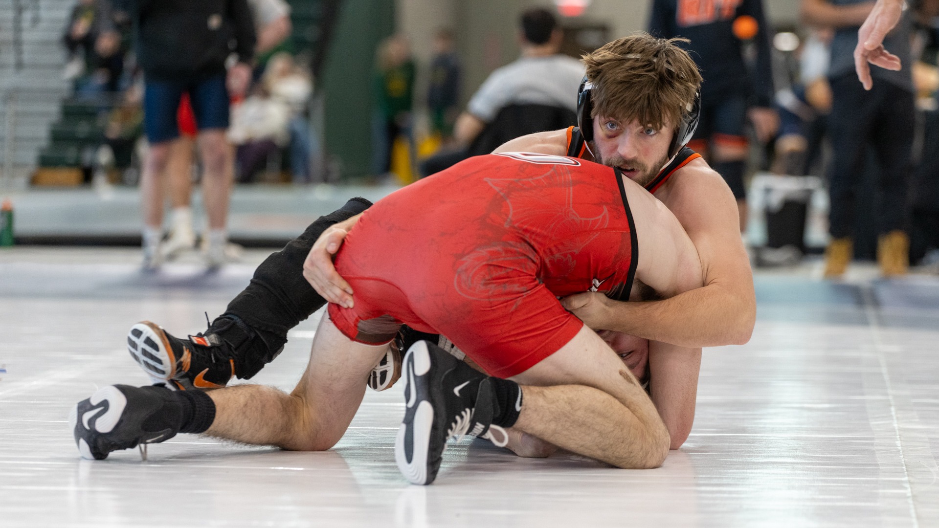 RIT’s Johnathan Freeborn gets on top of their opponents back on Friday, Jan. 23, 2026, at SUNY Brockport. RIT Wrestling at SUNYAC Championships (Sophia Buonpane/RIT Sports Network