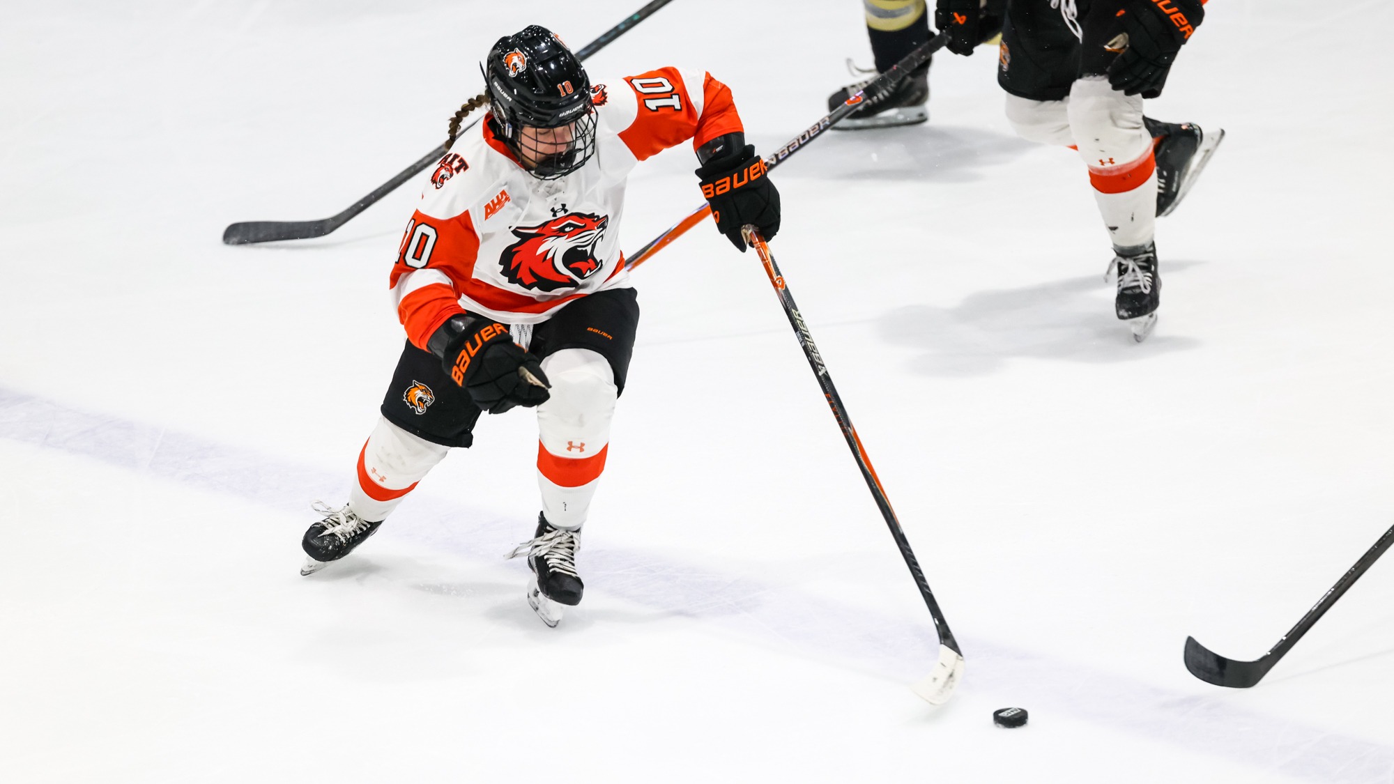 RIT's Zoe Ziotas, #10, reaches for the puck in game vs Lindenwood on Friday, Oct. 31, 2025, at Gene Polisseni Center. RIT Women's Hockey game vs. Lindenwood. (Mikaela Engstrom/RIT Sports Network).