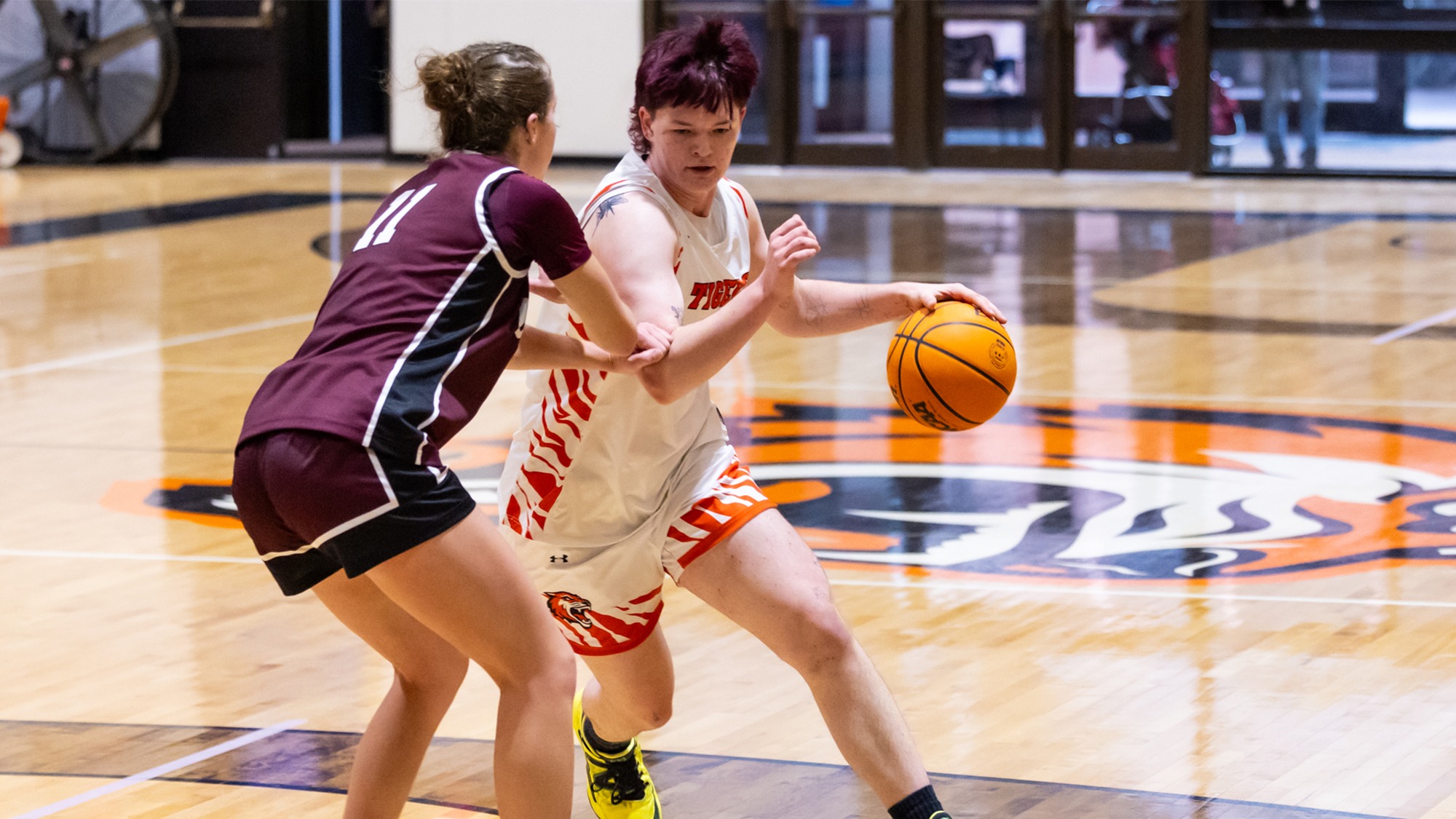 A women's basketball player for Rochester Institute of Technology dribbles past a defender in a game against Union on Saturday, January 3, 2026