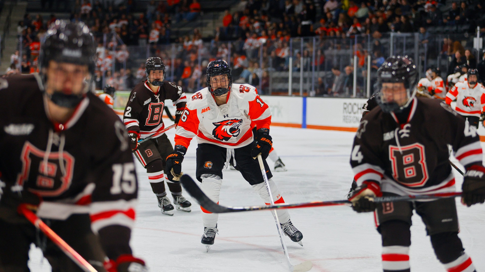 RIT's Brac Kelley, #16, skating towards action on Oct. 16, 2026, at Gene Polisseni Center in Rochester, N.Y. RIT Women’s Hockey takes on Brown Women’s Hockey in RIT’s Homecoming Series. RIT women's hockey vs Brown. (Sawyer Emery/RIT Sports Network).