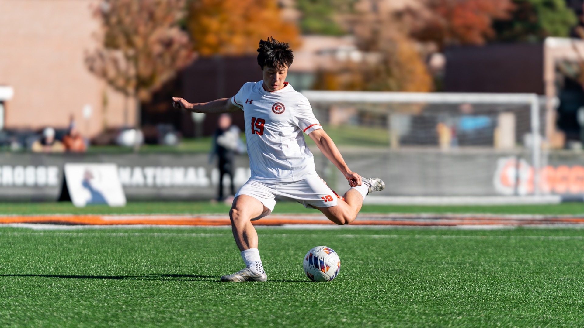 A RIT men's soccer player kicks the ball in a game against St. Lawrence on Saturday October, 17, 2026 at Judson Stadium