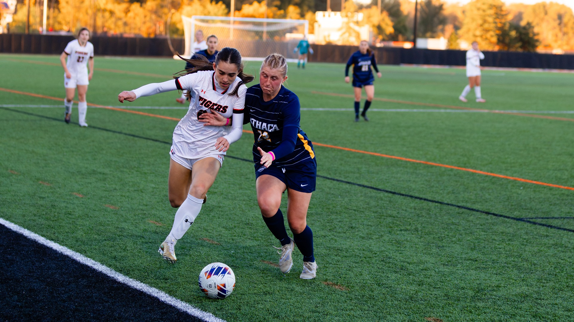 A women's soccer player from RIT and Ithaca battle for the ball in a game at Judson Stadium on Wednesday, October 21, 2026