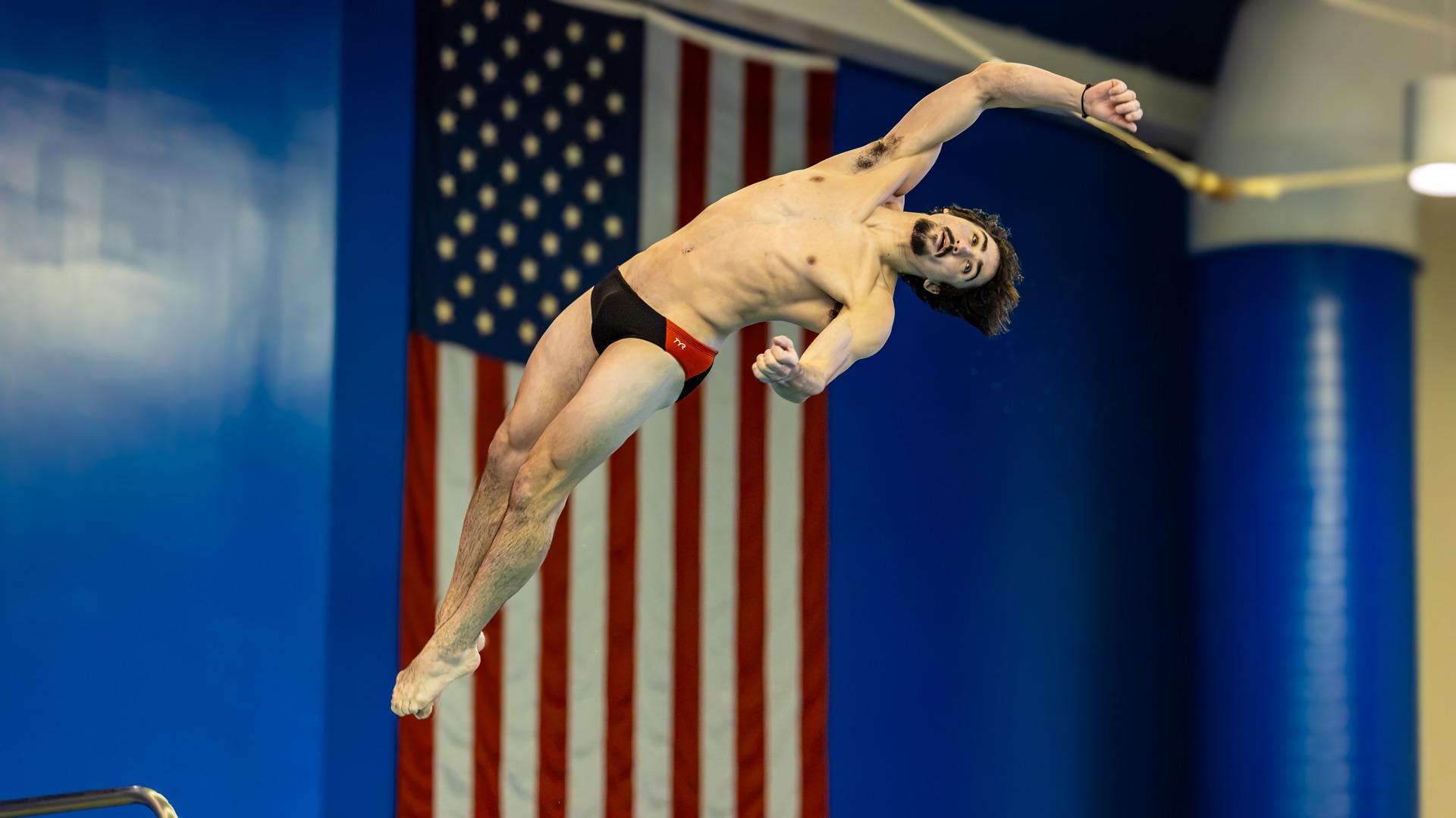RIT’s Luke Albanese, twisting his body in a flip on Friday, Oct. 23, 2026, at Judson/Hale Aquatics Center. RIT Athletics / Cole Quinones.