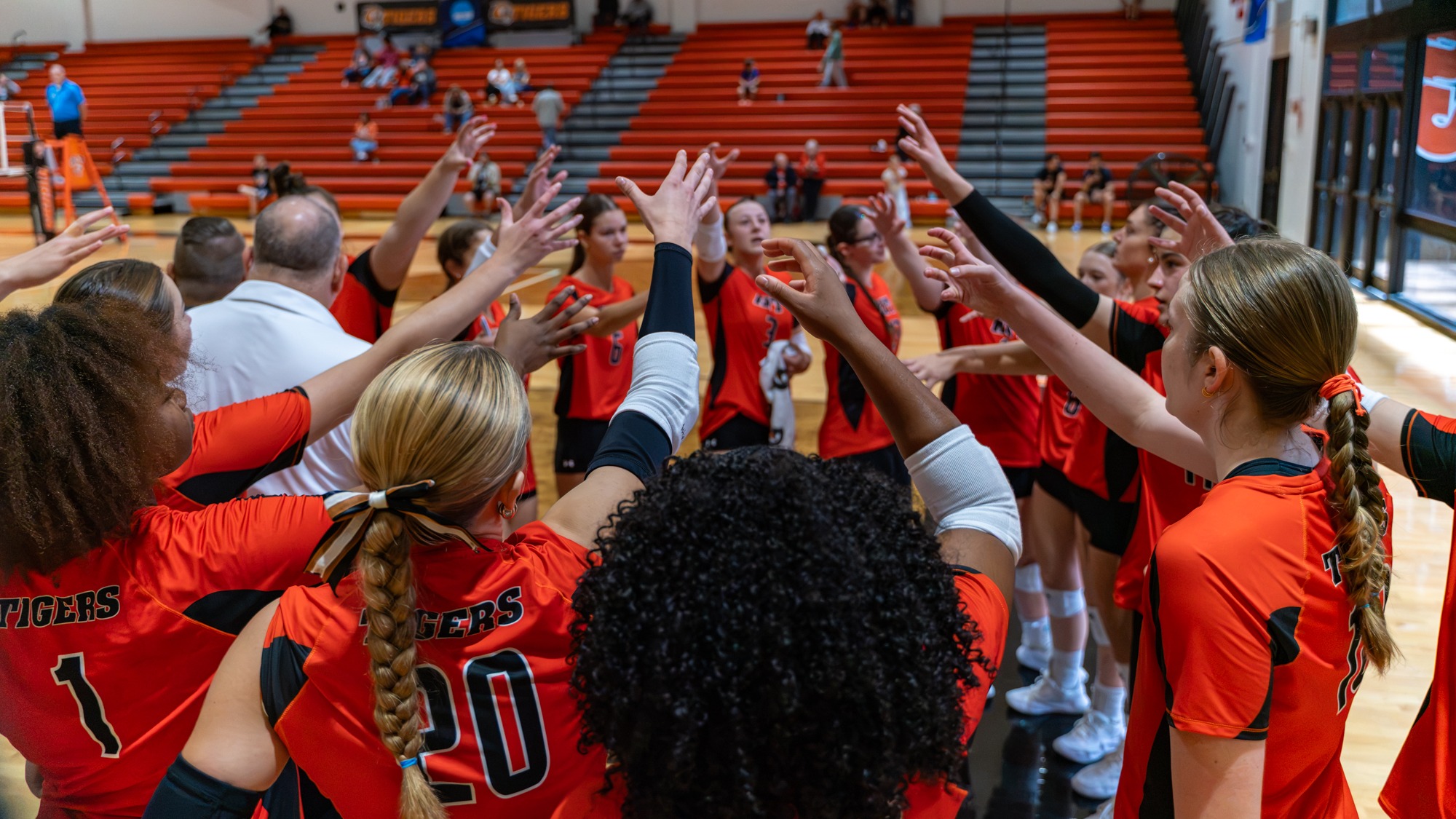 a women's volleyball huddle