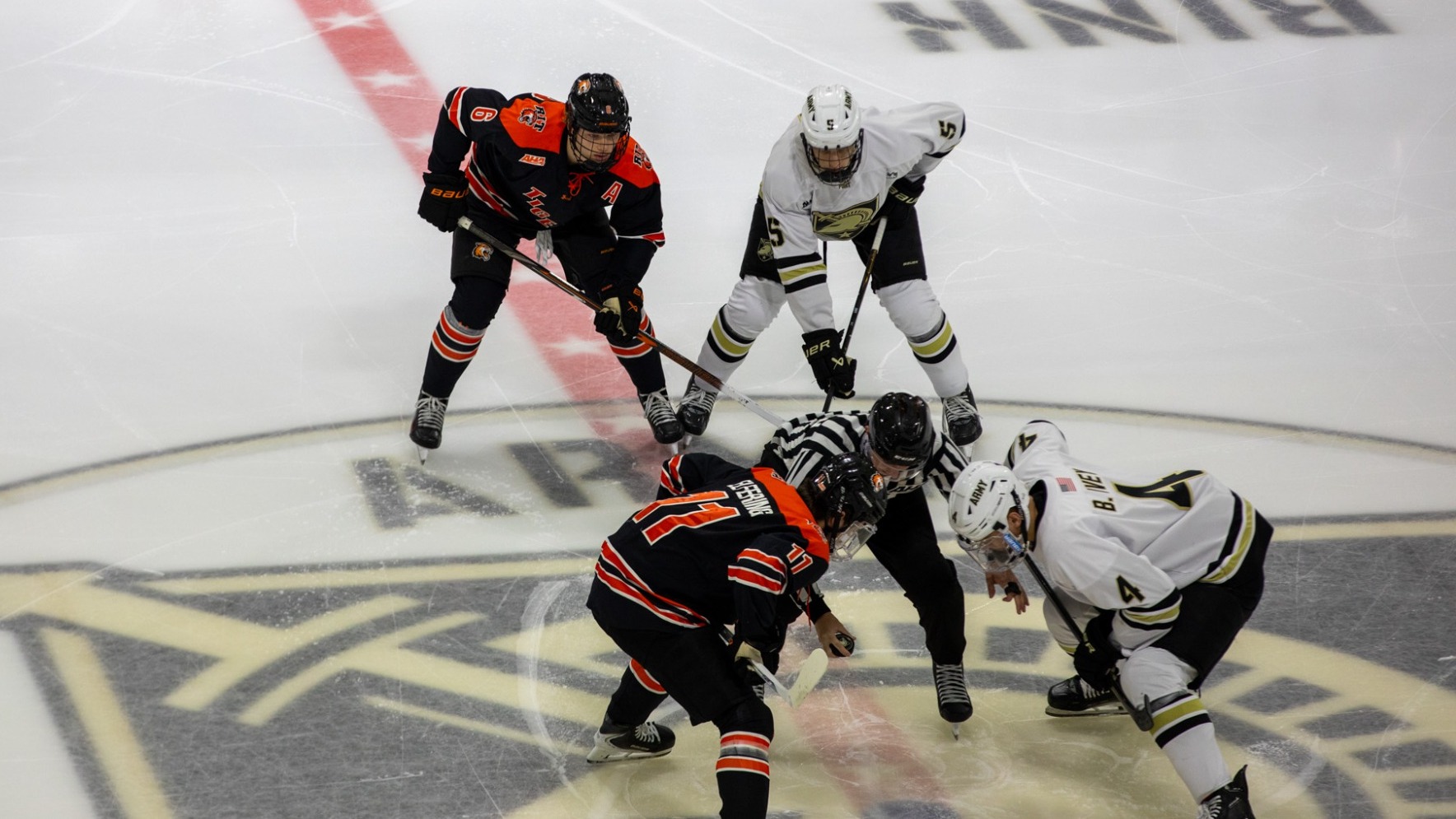 a men's hockey faceoff about to happen