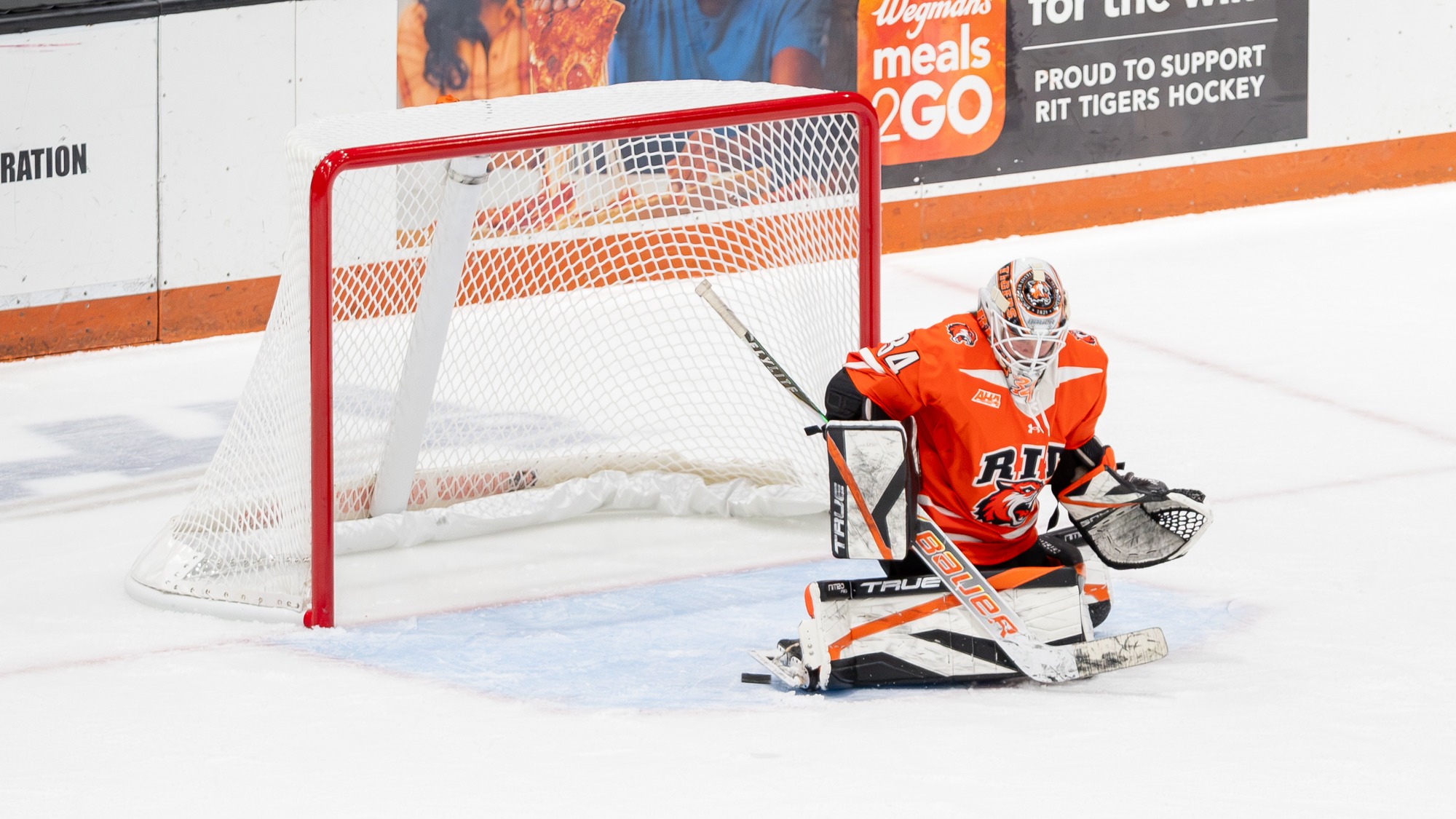 RIT's Oceanne Thiffault, #34, deflects a puck during game against Penn State on Friday, Oct. 30, 2026, at Gene Polisseni Center. RIT Women’s Hockey vs Penn State. RIT Athletics / Elizabeth Robertson.