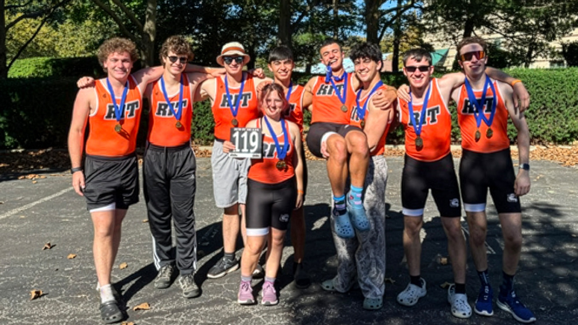 An RIT men's rowing team celebrates with their medals after winning an event at the Head of the Ohio in Pittsburgh on Saturday, Oct. 3, 2026