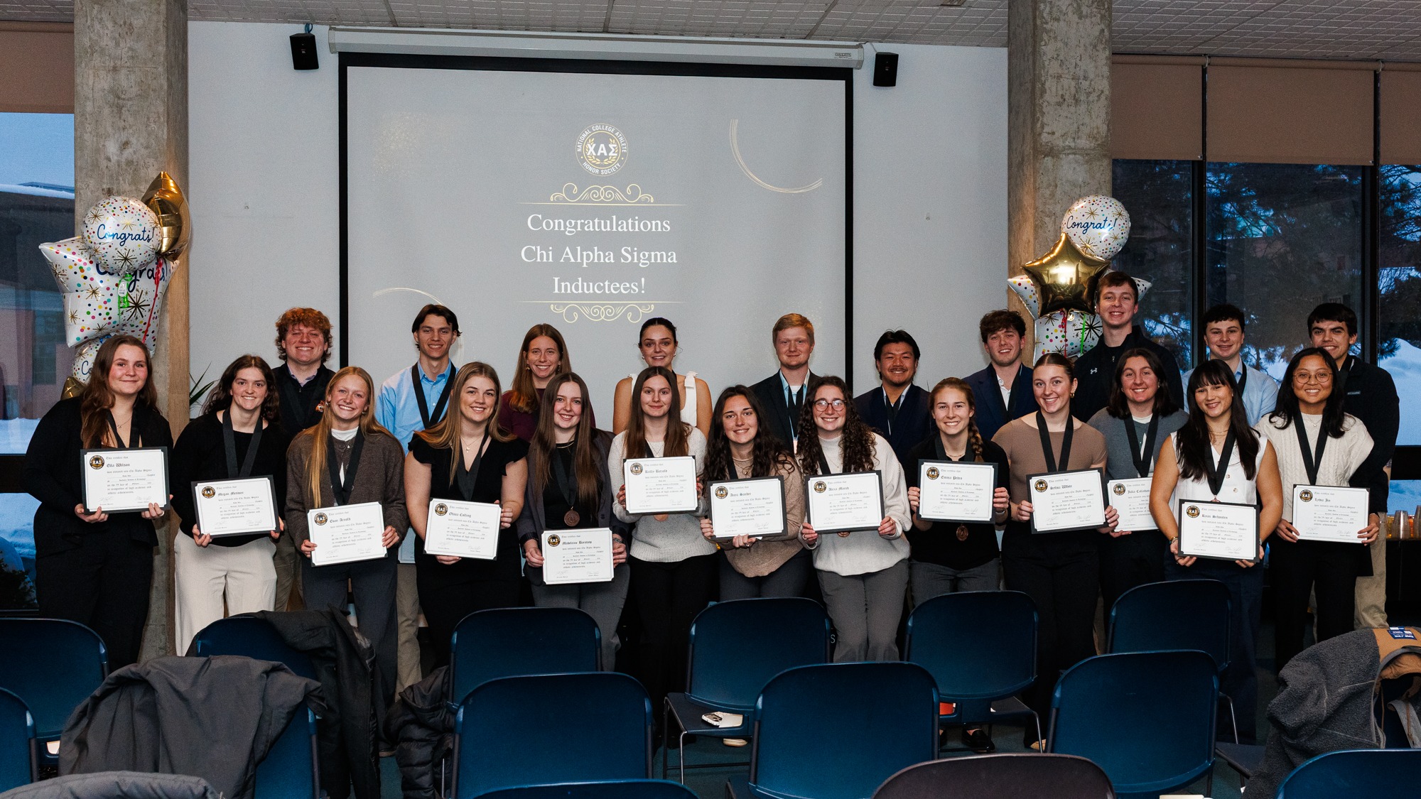 A group photo of all the inductees on Feb. 12, 2026, at Skalny Room in Rochester, N.Y. Chi Alpha Sigma Induction. (Sawyer Emery/RIT Sports Network).