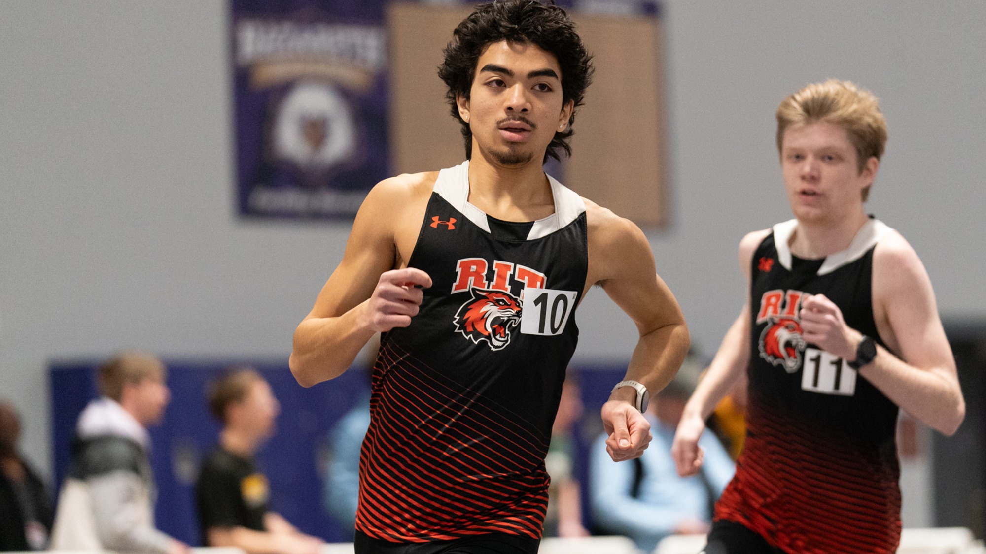 A member of RIT Men’s Track and Field team sprints down the track on February 14th, 2026, at the Golisano Training Center in Pittsford, New York. RIT Track and Field competes at the D3 Elite Invite hosted by Nazareth University.
