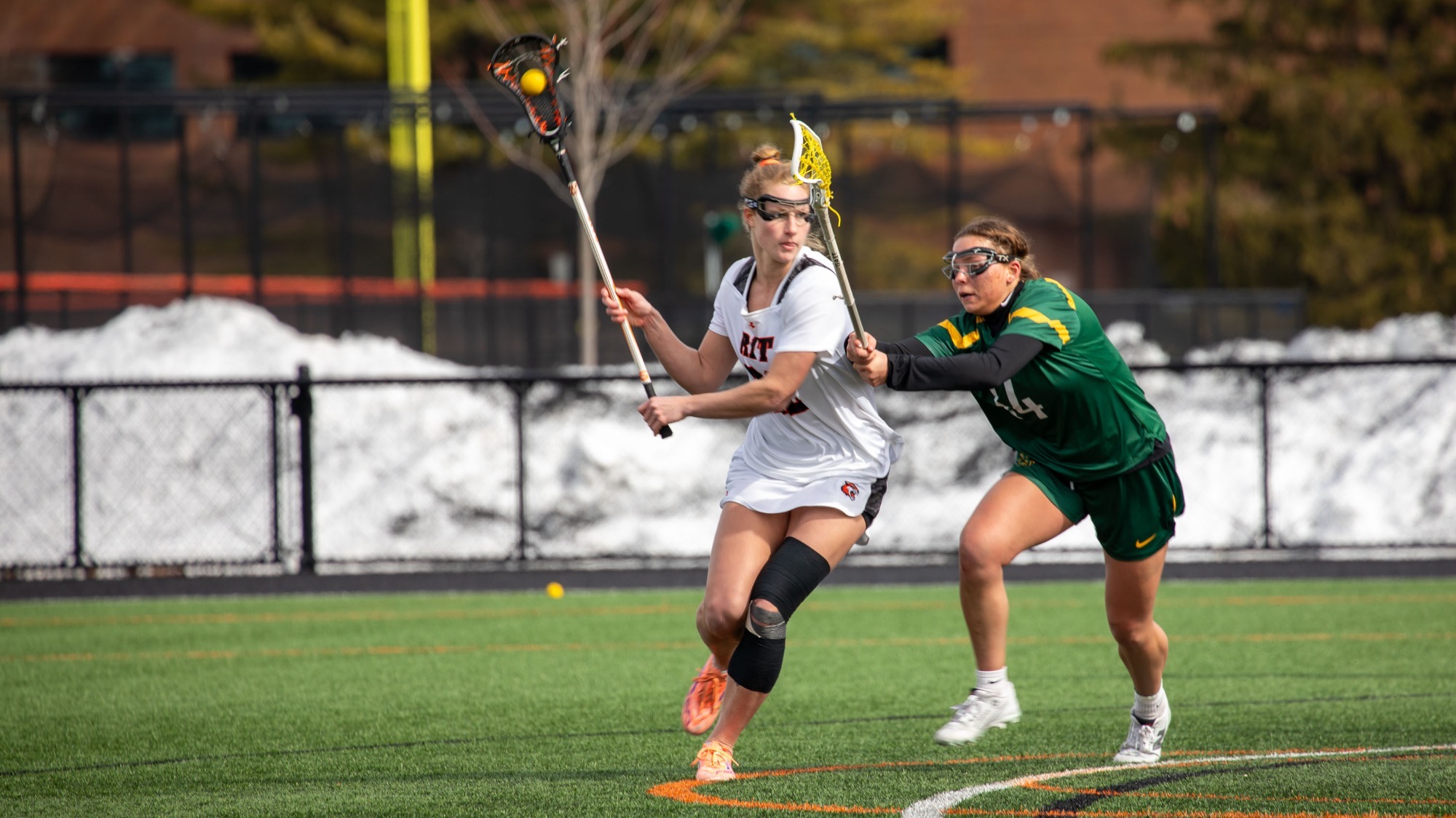 RIT’s Adele Jones, #22, passes the ball on Saturday, Feb. 28, 2026, at Tiger Stadium. RIT Women’s Lacrosse game vs Brockport. (RIT Athletics / Caitlyn Daproza).
