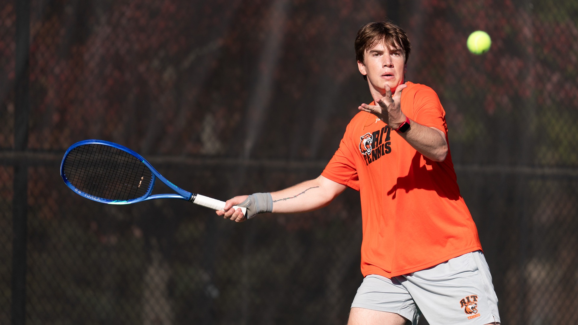 RIT’s Luke Weber hits the ball on October 12th, 2025, at the RIT Tennis Courts in Henrietta, New York. RIT Men’s Tennis match vs St. John Fisher. (Colin Norland/RIT Sports Network).