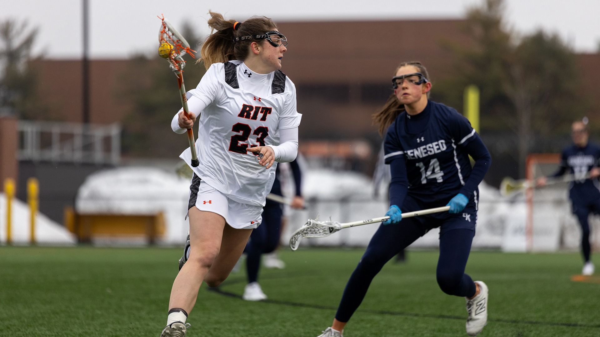 RIT’s Eliza Barton, #23, picks up the ball and races down the field on Saturday, Feb. 21, 2026, at Tiger Stadium. RIT Women’s Lacrosse Game vs. Geneseo (Sophia Buonpane/RIT Sports Network)