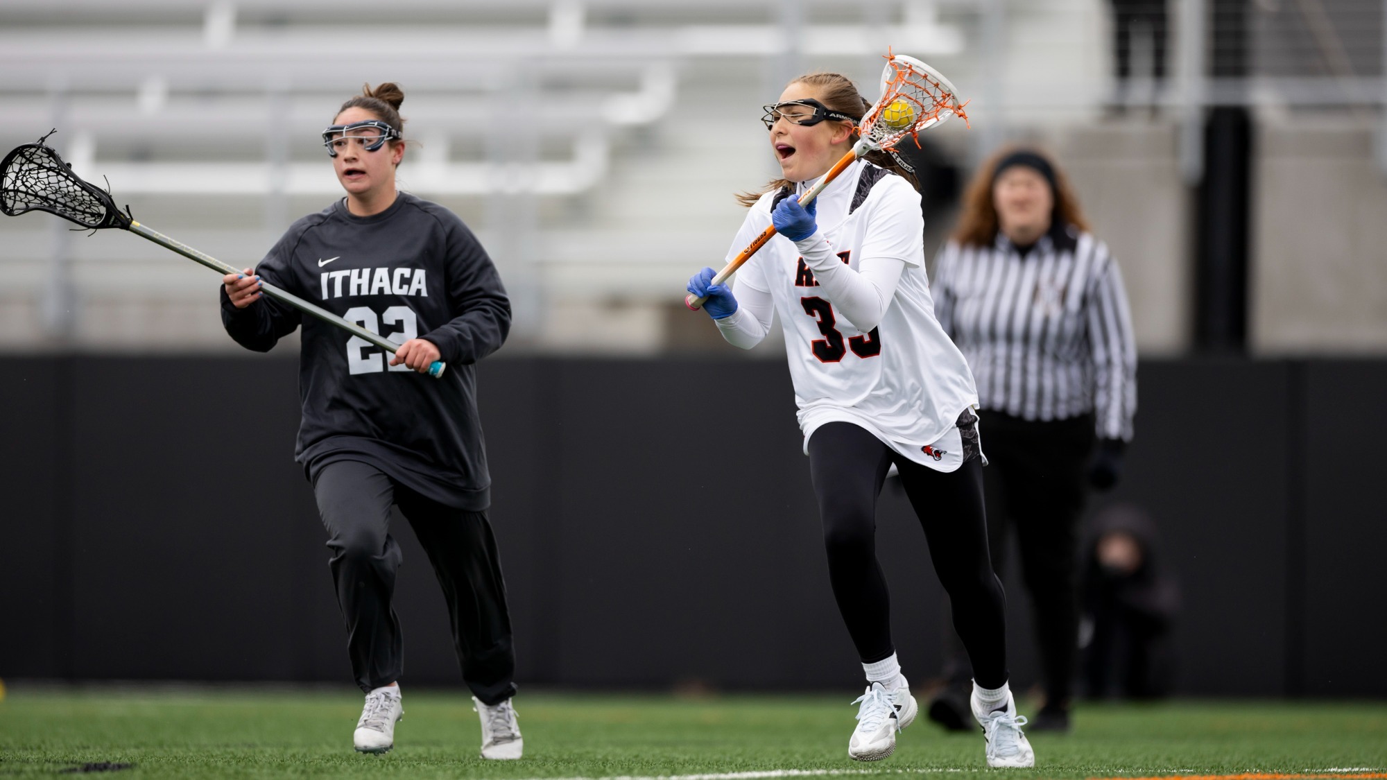 RIT’s Zoe Heffernan #33 moves the ball on Saturday, March 14, 2026 at Doug May Field in Henrietta, N.Y. The RIT women’s lacrosse team lost to Ithaca College 12-13. (Rebecca Villagracia/RIT Sports Network)