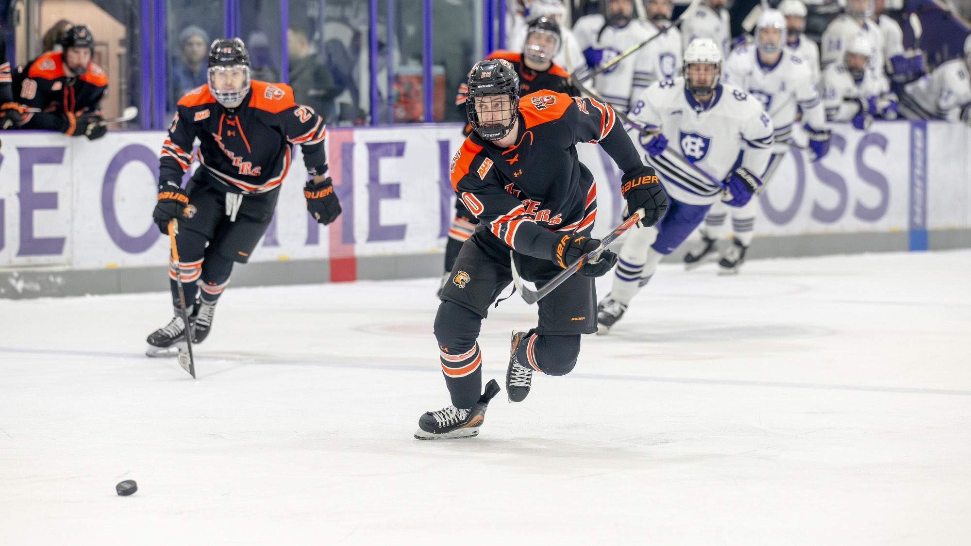 a men's hockey defenseman looking up ice