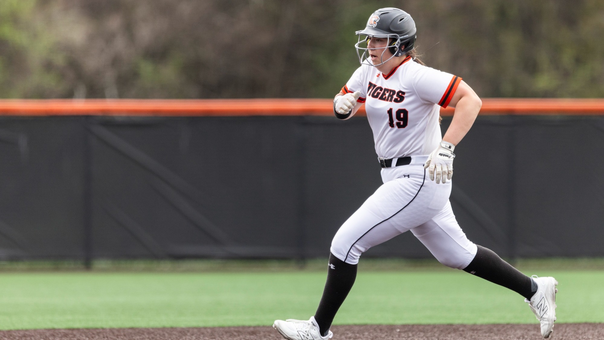 a softball player running the bases