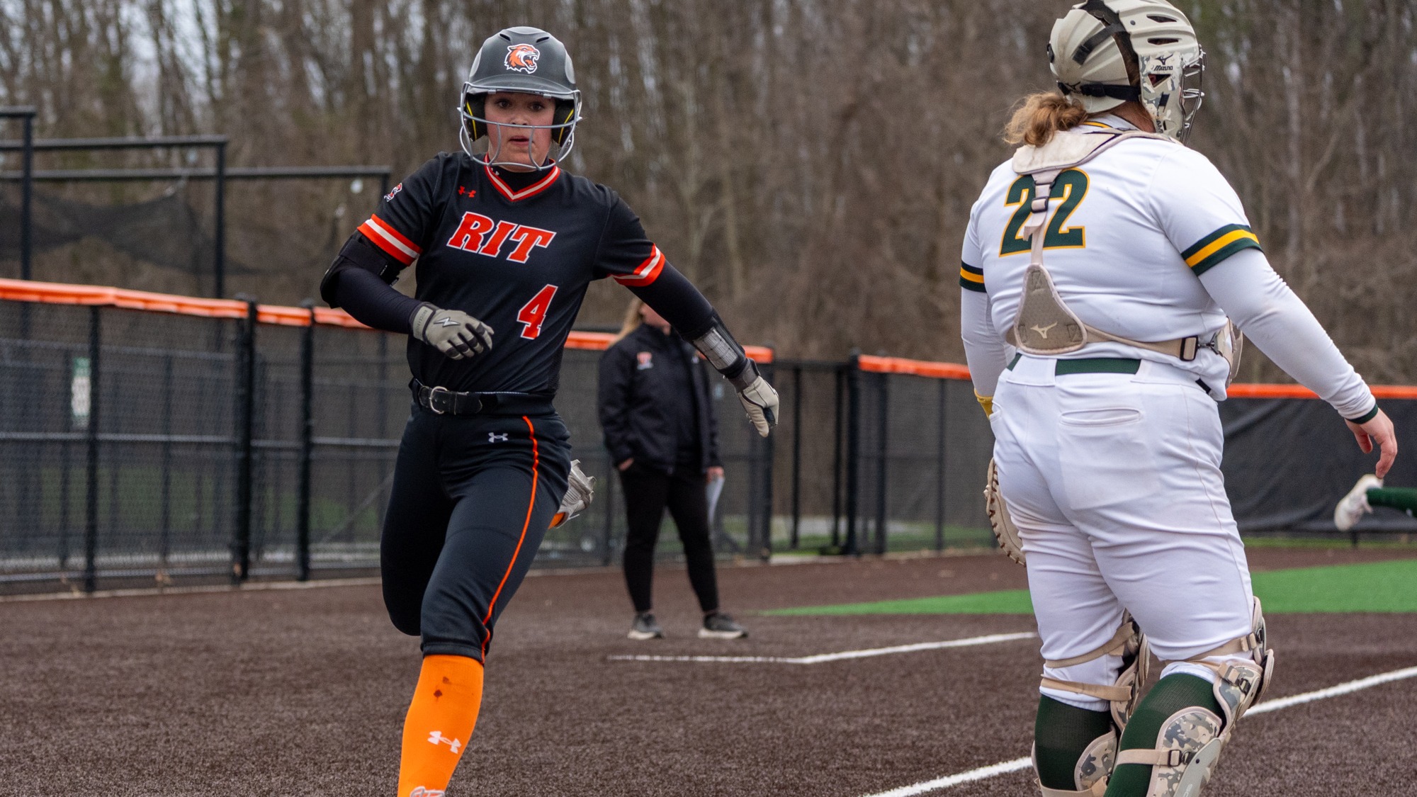 a base runner crossing home plate