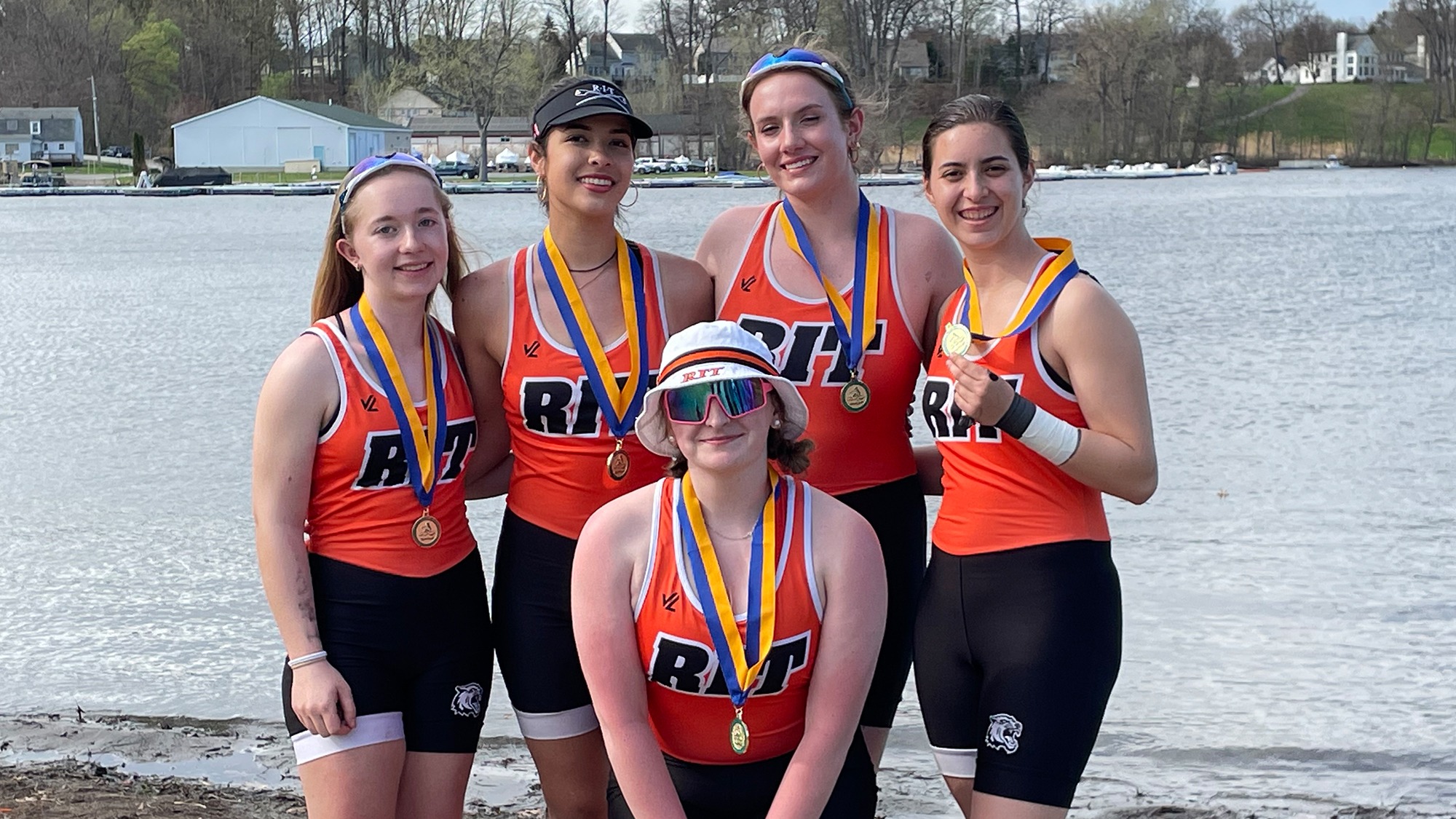 a women's rowing team from RIT celebrates after wining medals at the NYS Collegiate Championships on Saturday, April 18, 2026 in Saratoga Springs, N.Y.