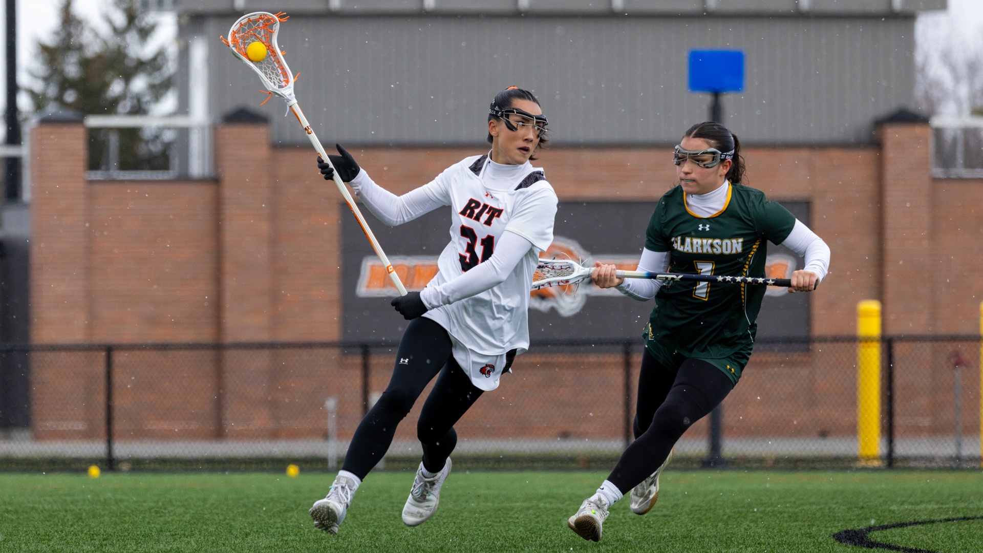 RIT’s Kate Trojan, #31, races past their opponent on Saturday, Mar. 28, 2026, at Judson Stadium. RIT Women’s Lacrosse Game vs. Clarkson (Sophia Buonpane/RIT Sports Network)