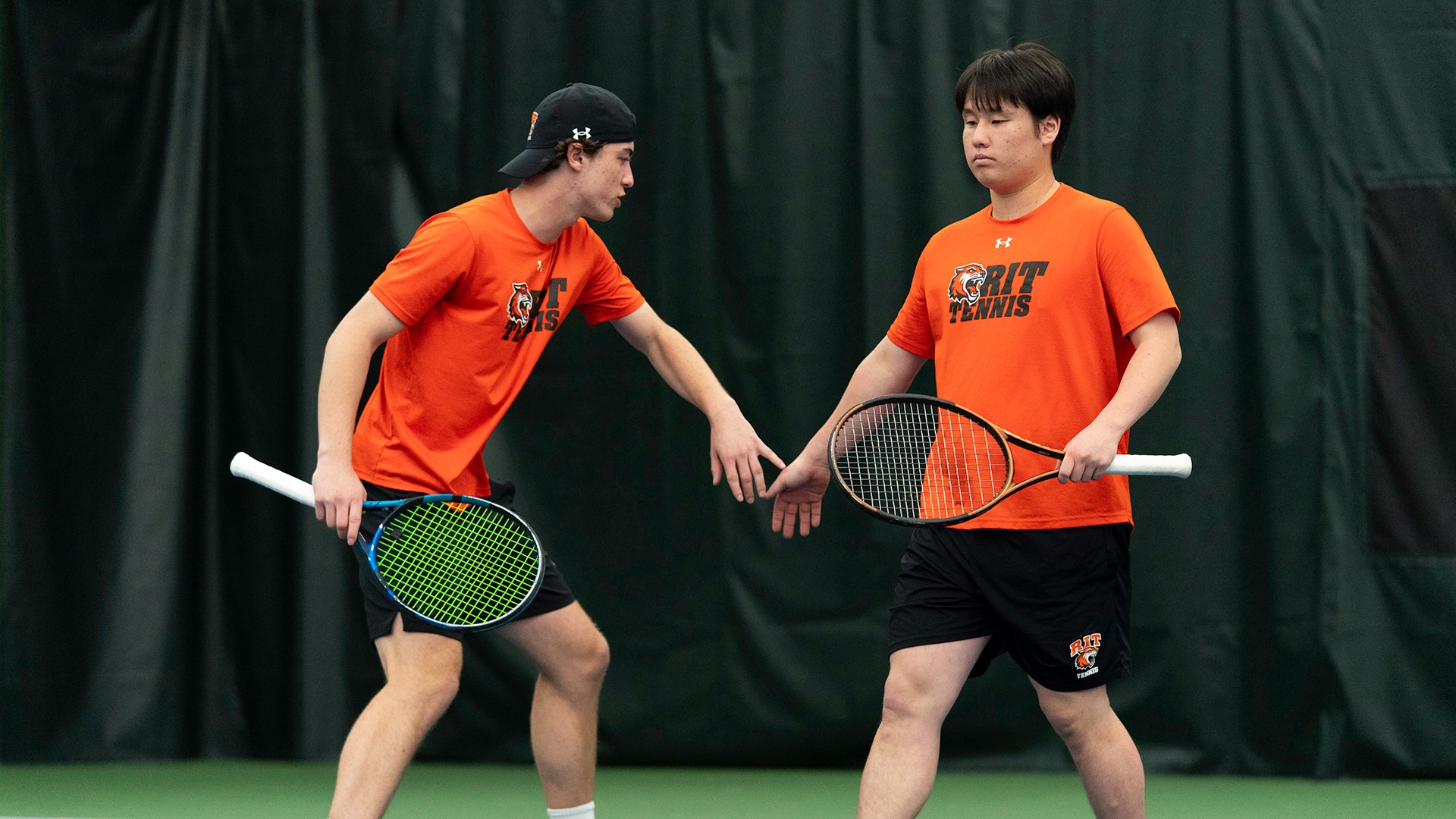 RIT’s Alexander Sinclair celebrates with Yu Tanimoto on April 25th, 2026, at Midtown Athletic Club in Brighton, New York. RIT Mens Tennis played Hobart. (Colin Norland/RIT Sports Network).