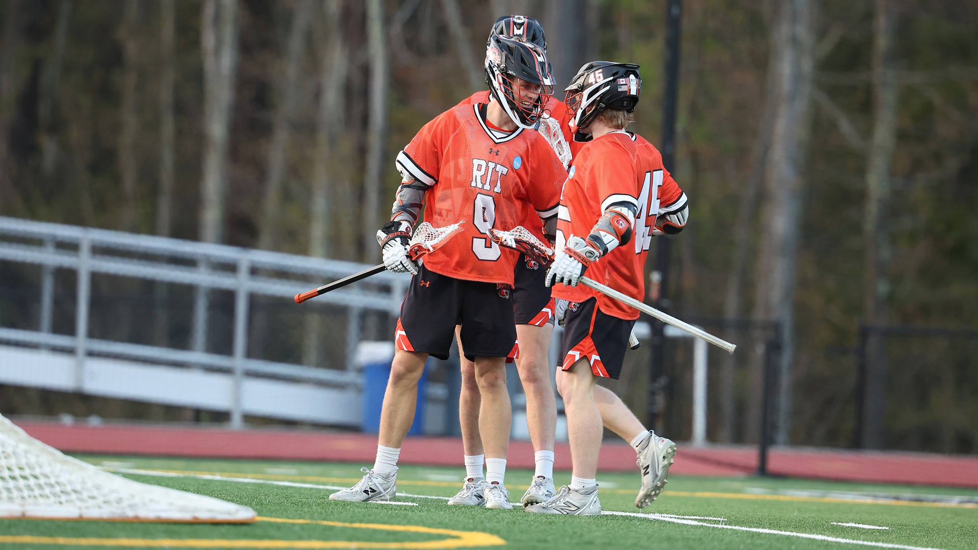A photo of Erich Acton and Ethan Harkins celebrating a goal against Babson in NCAA Quarterfinal