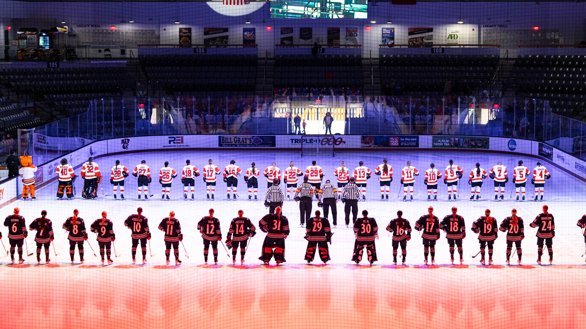 A photo of the women's hockey team lined up for the national anthem before a game
