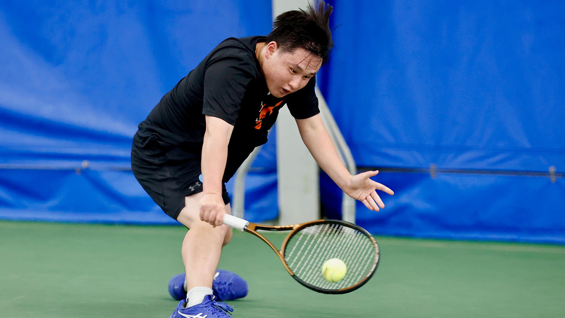 A photo of Yu Tanimoto returning a shot at the 2026 NCAA Championships