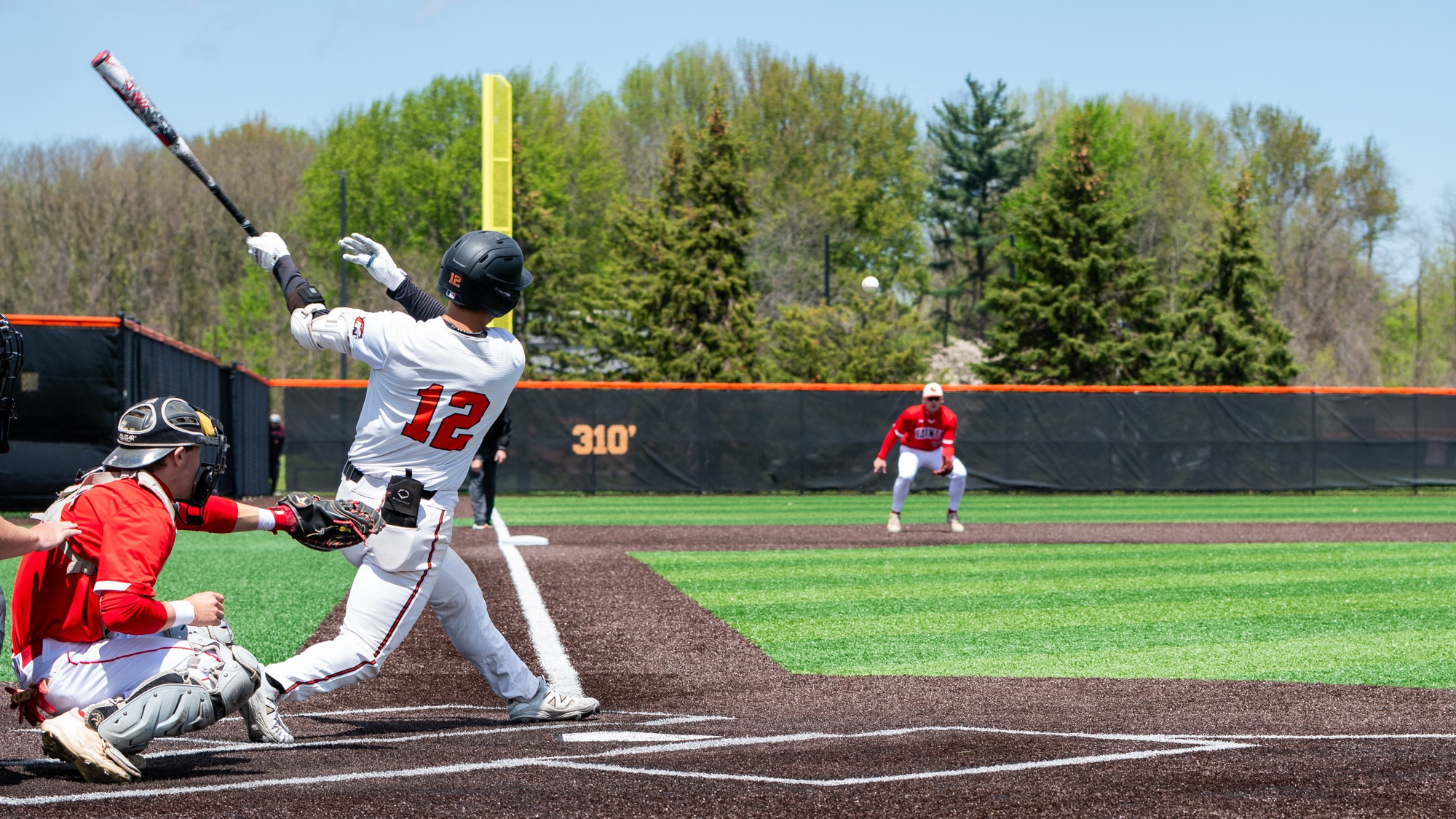 RIT's Caelan Kim, #12, hit a line drive during game one against St. Lawrence University in the Liberty League Baseball Championship on Thursday, May 7, 2026, at Rochester Institute of Technology. RIT Baseball vs. St. Lawrence University. (Elizabeth Robertson/RITAthletics) 