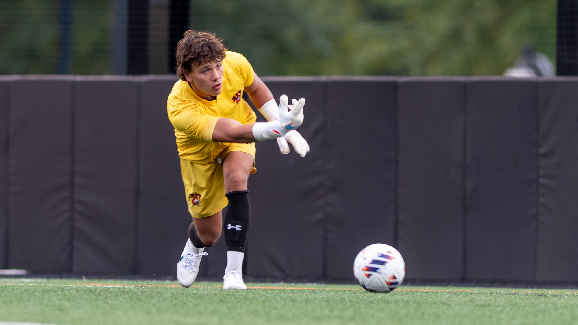 RIT's Kristian Dobbek, #1, rolled the ball to teammate on Friday, Sept. 4, 2026, at Thomas Fearey Judson Jr. Stadium during game against Fredonia College. RIT Athletics / Elizabeth Robertson.
