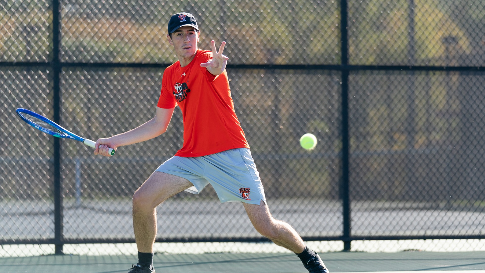 Preparing to hit the ball RIT’s Tyler Mitrovic sticks out his hand on October 12th, 2025, at the RIT Tennis Courts in Henrietta, New York. RIT Men’s Tennis match vs St. John Fisher. (Colin Norland/RIT Sports Network).