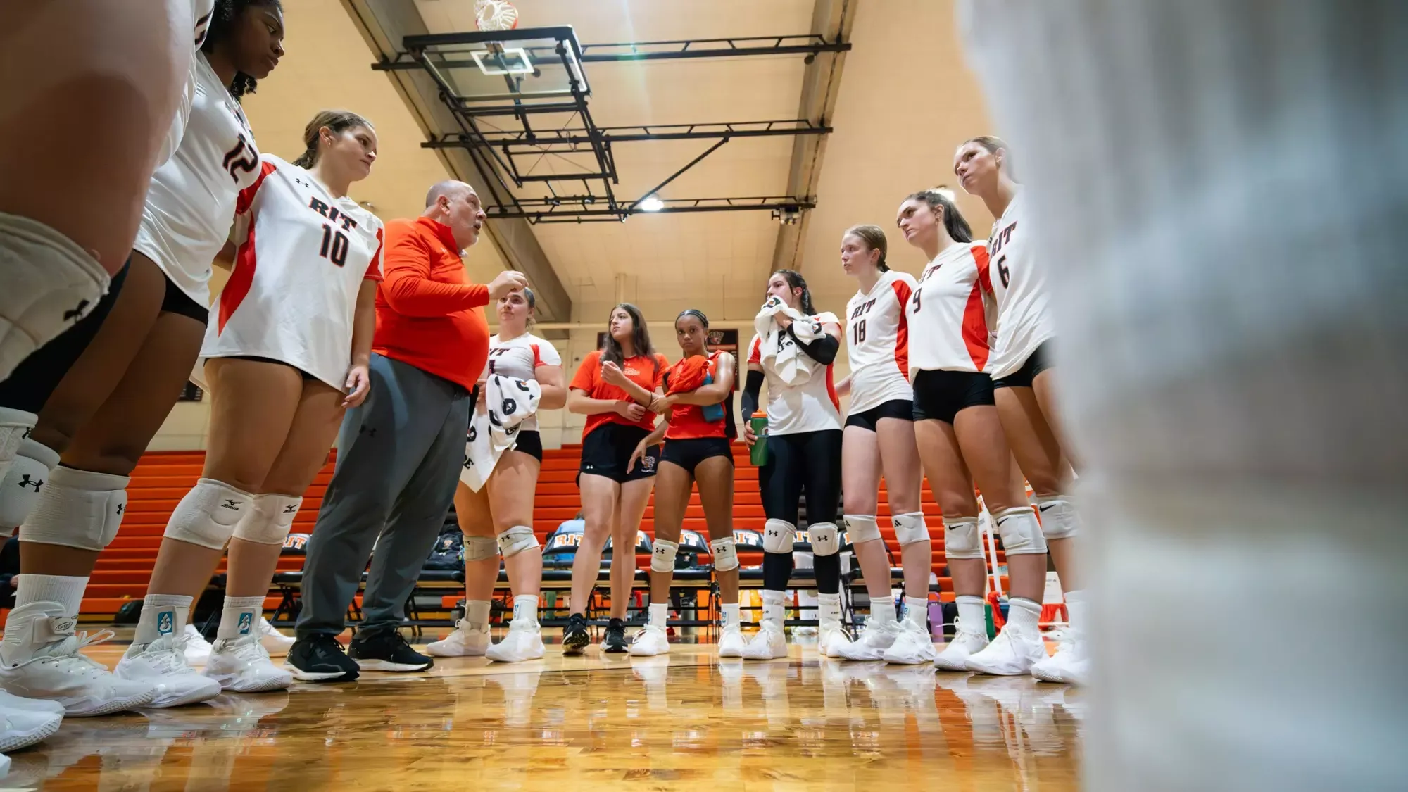 a women's volleyball huddle