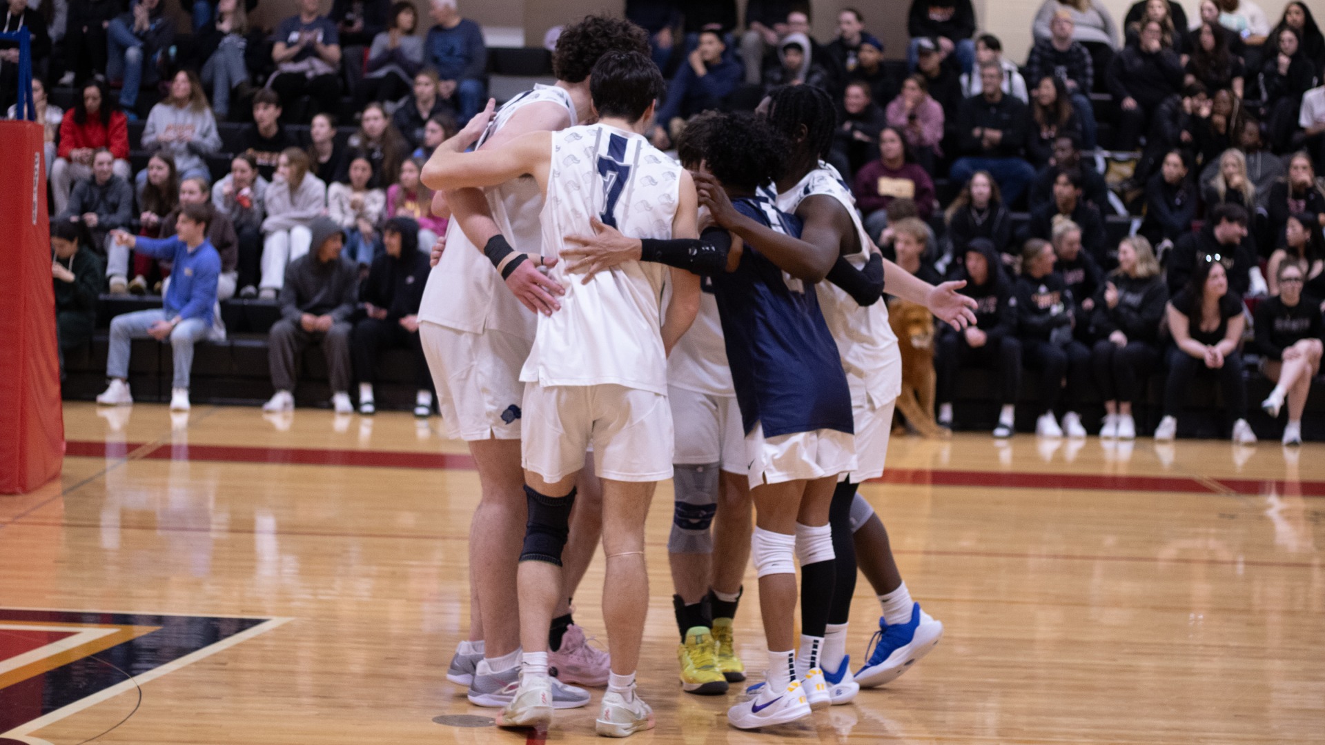 Team huddles after point