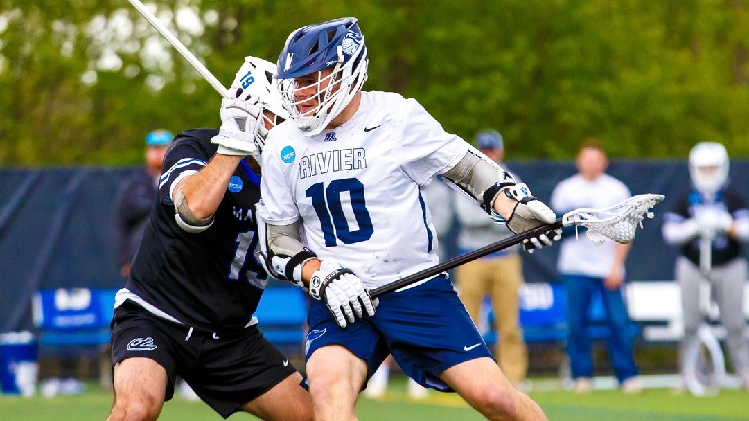 Ference fends off defender