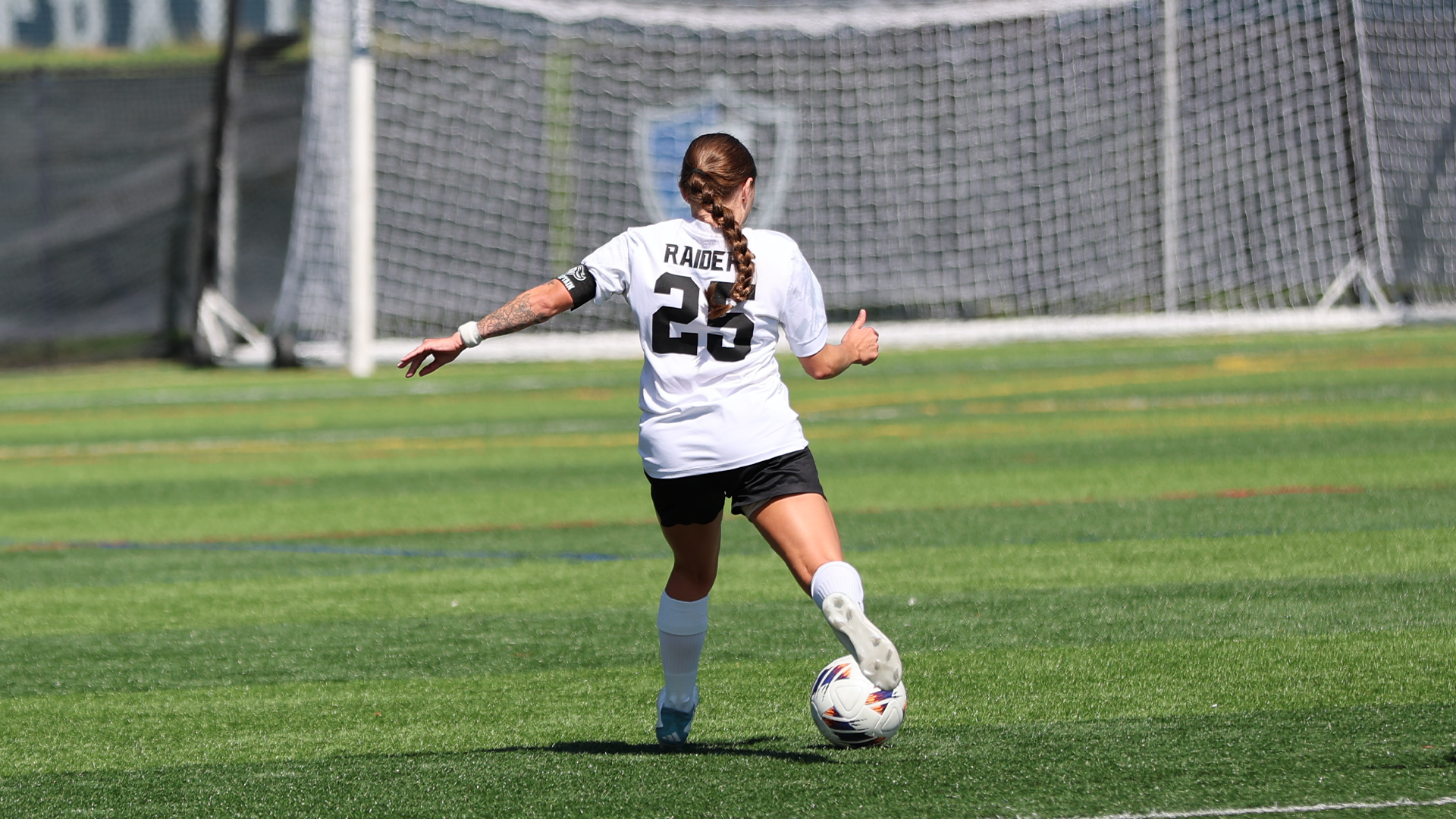 Amber Caser Kicking Ball