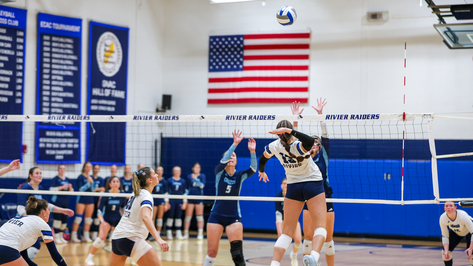 Ashlee Salafia jumping to hit ball