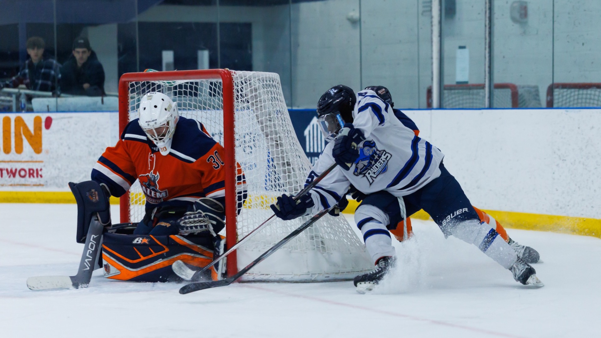 Evan Miles shooting the puck 